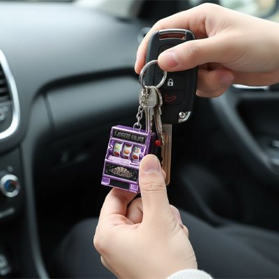 Porte clé machine a sous effets sonores lumineux