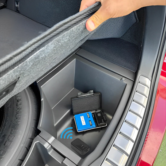 traceur gps voiture dans rangement coffre